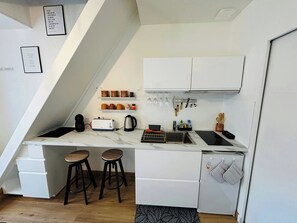 Fridge, microwave, coffee/tea maker, toaster