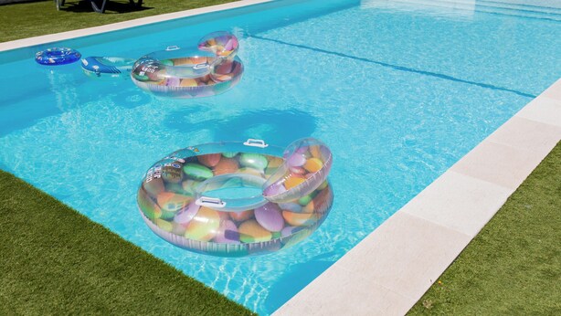 A swimming pool with two inflatable rings filled with colorful objects. - Gothes Chalet Javier!! (Ponte de Vagos)