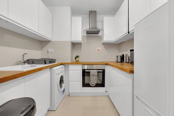 Fridge, microwave, stovetop, coffee/tea maker