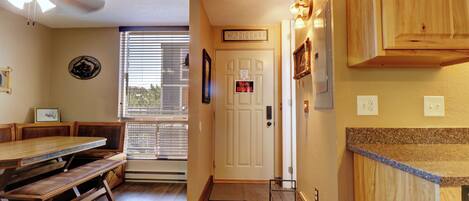 A kitchen with wooden cabinets, a bench, and a ceiling fan.