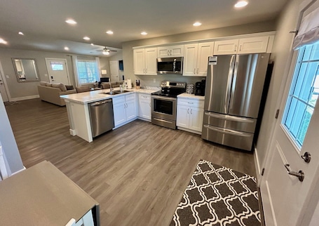 Fridge, microwave, oven, stovetop. Serene & Modern Oasis - Newly Built, Attached Garage, Centrally Located