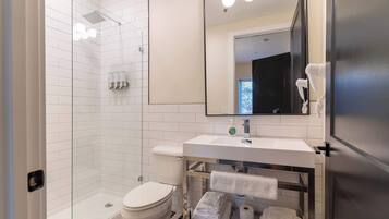 Shower, hair dryer, towels, shampoo