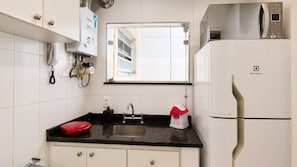 Coffee/tea maker, fridge, microwave, oven