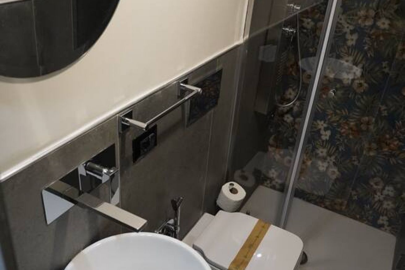 Shower, hair dryer, towels, shampoo