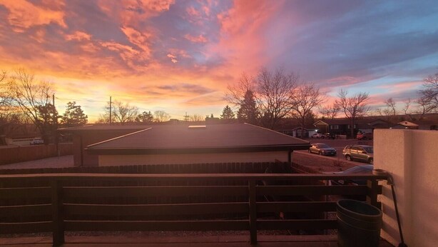 A rooftop with a flat surface, a wooden fence, and a trash bin. - Entire guest suite in Colorado Springs, Colorado (Colorado Springs)