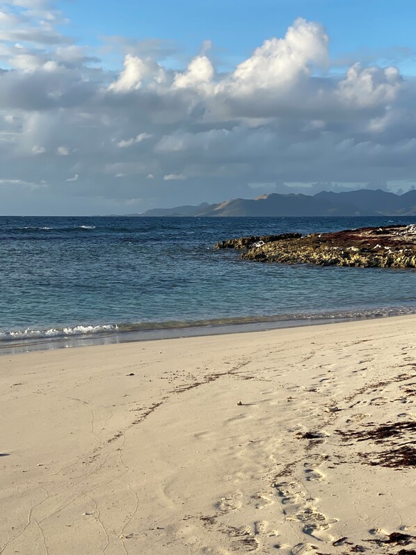 On the beach, sun loungers, beach towels