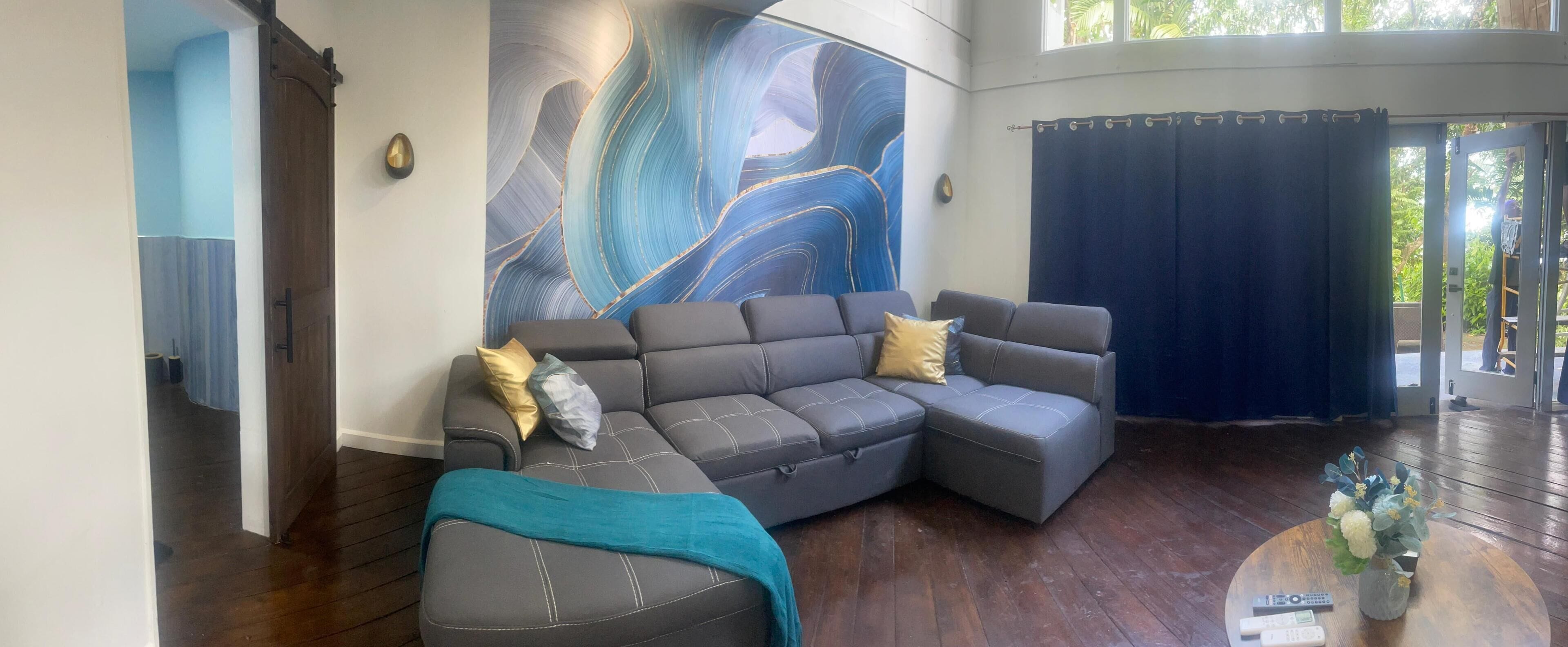 Deluxe Suite, Partial Ocean View, Annex Building | Living area | 50-inch TV with digital channels