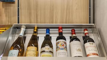 A wine cooler with six bottles of wine.