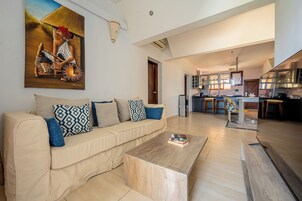 Standard Apartment, Beach View | Living area | Flat-screen TV