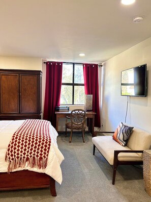 A bedroom with a bed, a desk, a chair, and a TV. - Hillside + View+ First Level + Pool + Remodeled!
Close to USC Keck & Attractions (Los Angeles)