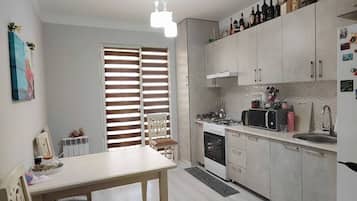Fridge, microwave, cookware/dishes/utensils