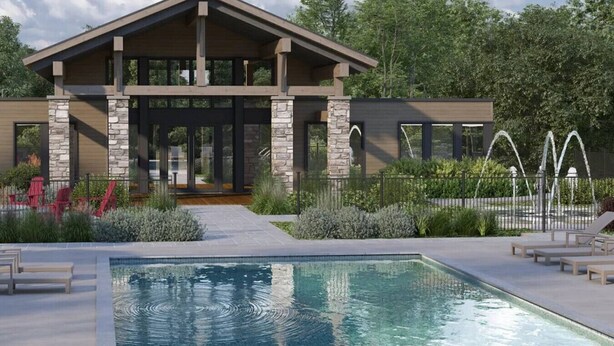 A modern building with a pool area, stone pillars, and a covered patio. - The Stella, minutes to the village/free shuttle (Mont-Tremblant)