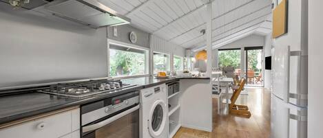 Fridge, stovetop, dishwasher, coffee/tea maker