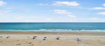 Updated direct oceanfront 3/2 corner with a wrap-around balcony overlooking the heated pool