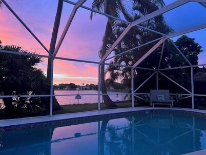 Charming 3-bedroom pool home on the lake with spectacular sunsets & close to all