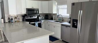 Charming 3-bedroom pool home on the lake with spectacular sunsets & close to all