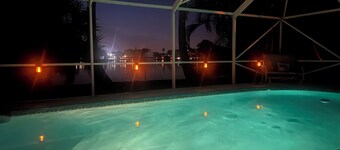 Charming 3-bedroom pool home on the lake with spectacular sunsets & close to all