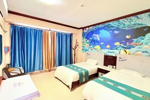 A hotel room with two beds, a mural of an underwater scene, and a 'Be happy' sign on the headboard. - Hilton Hotel (Taishan)