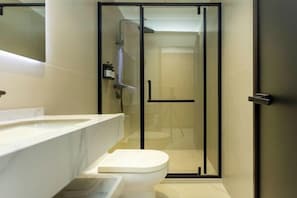 A modern bathroom with a glass-enclosed shower, a white sink, and a toilet. - Super 8 Shanghai Dongjing Huanlegu Dongye Road (Shanghai)