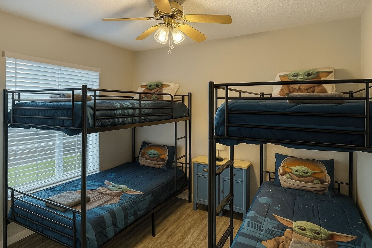 A bunk bed room with Star Wars-themed bedding and pillows.
