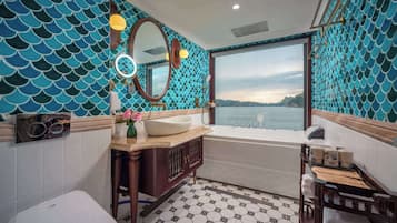 A bathroom with a bathtub, a sink, and a toilet.