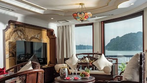Royal Palace Cabin | Living area | 30-inch flat-screen TV with cable channels, TV, DVD player - L'amour Cruise (Tuan Chau)