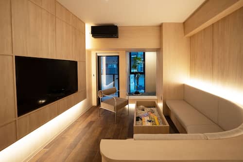 Premium bedding, desk, laptop workspace, soundproofing