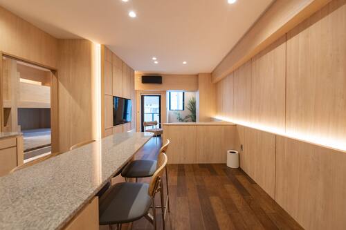 Premium bedding, desk, laptop workspace, soundproofing