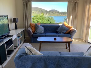 Living area - Waterfront Cottage Parua Bay. Beaches, mountains.Walking distance to shops (Parua Bay)