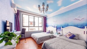 A room with two beds, a desk, a chair, a plant, and a mural of the sea. - Shengsi Yajing Homestay (Shengsi)