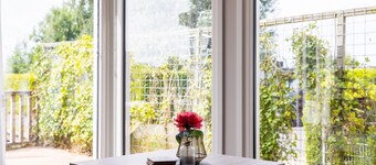 Two large chalets side by side with two sloops