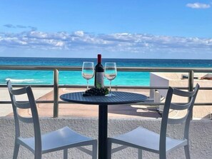 Enjoy a romantic dinner for two on this seaside terrace overlooking the ocean.