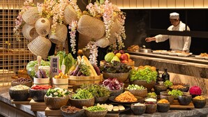 A buffet with various food items and decorative elements. - Wellspring by Silks Beitou (Taipei)