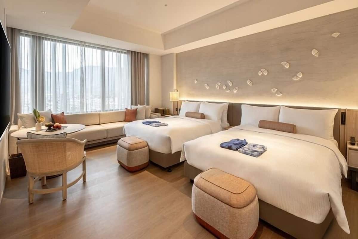 Deluxe Family Room | 1 bedroom, down comforters, free minibar, in-room safe