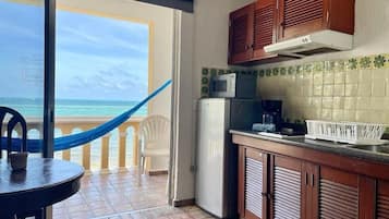 Fridge, microwave, coffee/tea maker, cookware/dishes/utensils