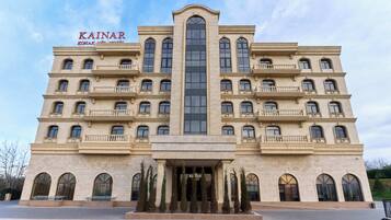 Kainar's grand facade features a striking central window and elegant balconies.