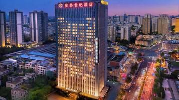 A high-rise hotel with a modern design, multiple floors, and a prominent entrance.