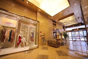Shop and unwind in this stylish space with a clothing store and cozy seating area.