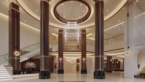 A spacious lobby with a grand staircase, large columns, and a central chandelier. - Shexiang Hongbin Hotel (Jingning)