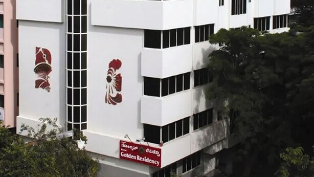 A white building with a sign reading "Golden Residence." - Golden Residency (Bengaluru)