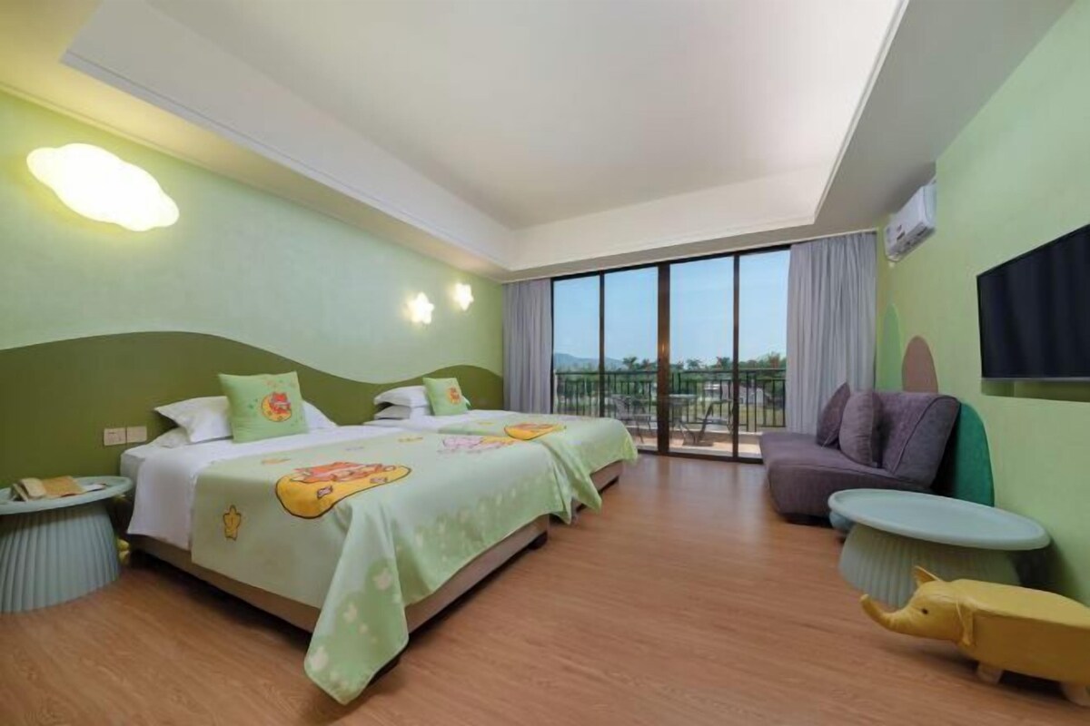 A hotel room with a bed, a sofa, a small round table, a balcony with a view, and a large window.