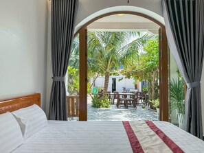 Family Double Room, Garden View | Laptop workspace, blackout curtains, soundproofing, iron/ironing board