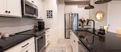 Coffee/tea maker, fridge, microwave, oven