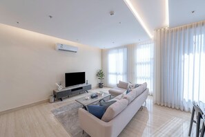 Luxury Apartment, 3 Bedrooms, Balcony, Garden View | Living area | Flat-screen TV - Mabaat - Al Qirawan - 557 (Riyadh)