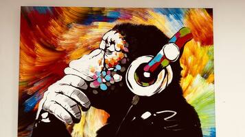 A painting of a person playing a trumpet with a colorful background.