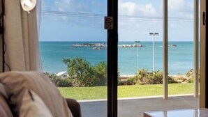 A room with a view of the sea, a window with a view of the sea, and a door. - The Dolphins 1 – Beachfront Holiday Apartment | 1/10 Strangways Terrace (Port Elliot)