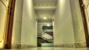 A grand hallway with marble flooring and ornate wall decorations. - Hotel Kamal (Kathmandu)