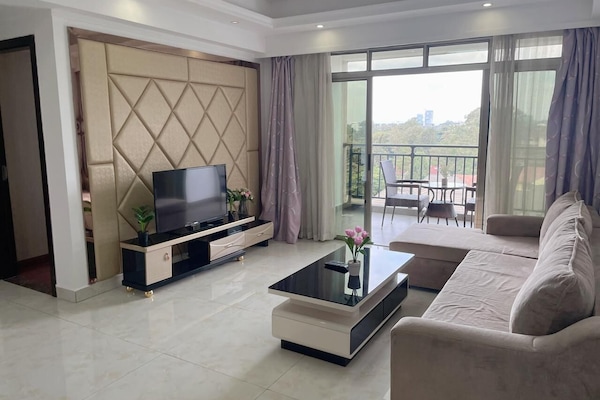 Business Room, 2 Bedrooms | Living room | 39-inch flat-screen TV with cable channels, ping pong, pay films