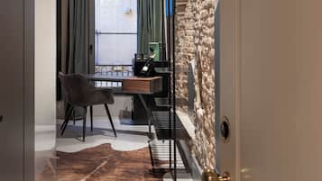 Deluxe Studio Suite, Balcony, City View | Living area | 50-inch Smart TV with digital channels, Netflix, pay films