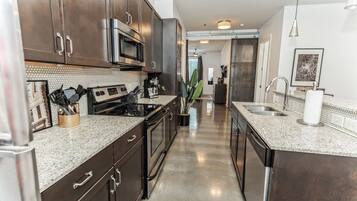 Condo, 1 King Bed with Sofa bed, Kitchen, City View (Harmony Hideaway) | Private kitchen | Fridge, microwave, oven, stovetop